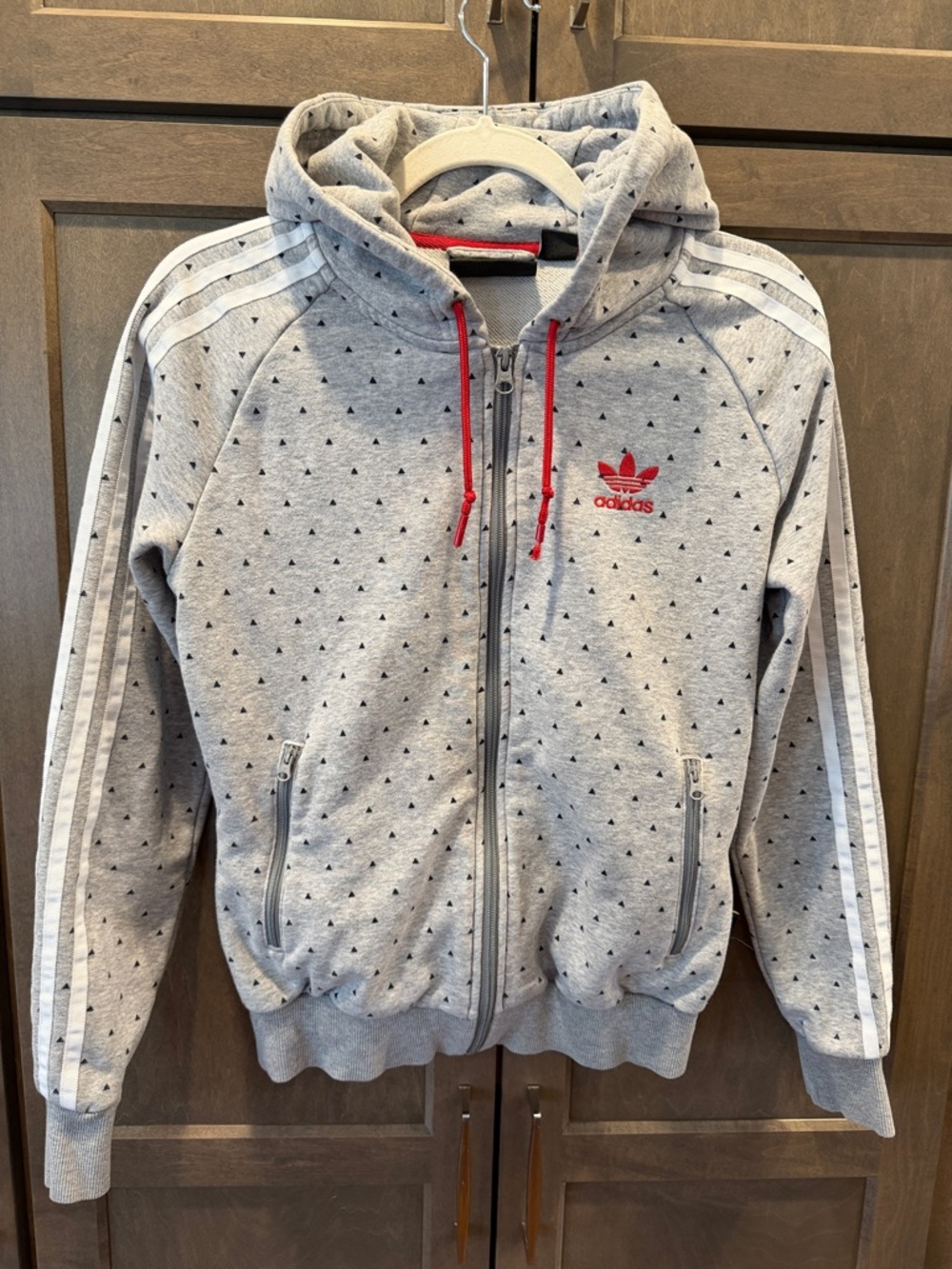 adidas x Pharrell Gray Zip Hoodie with White Stripes and Red Accents